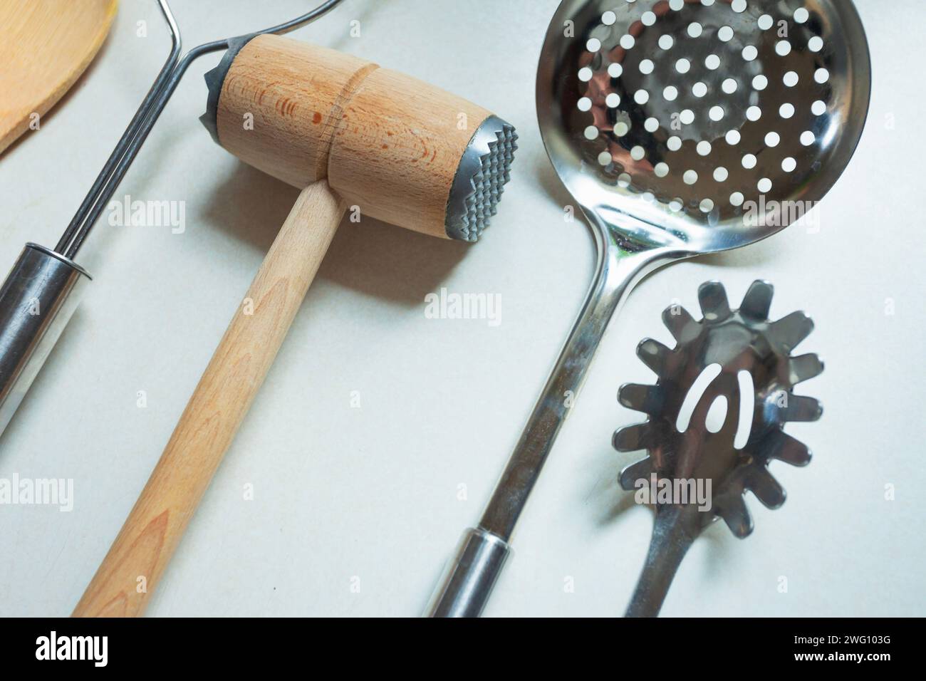 Various kitchen utensils on light background, top view. Kitchen appliances, lay flat Stock Photo