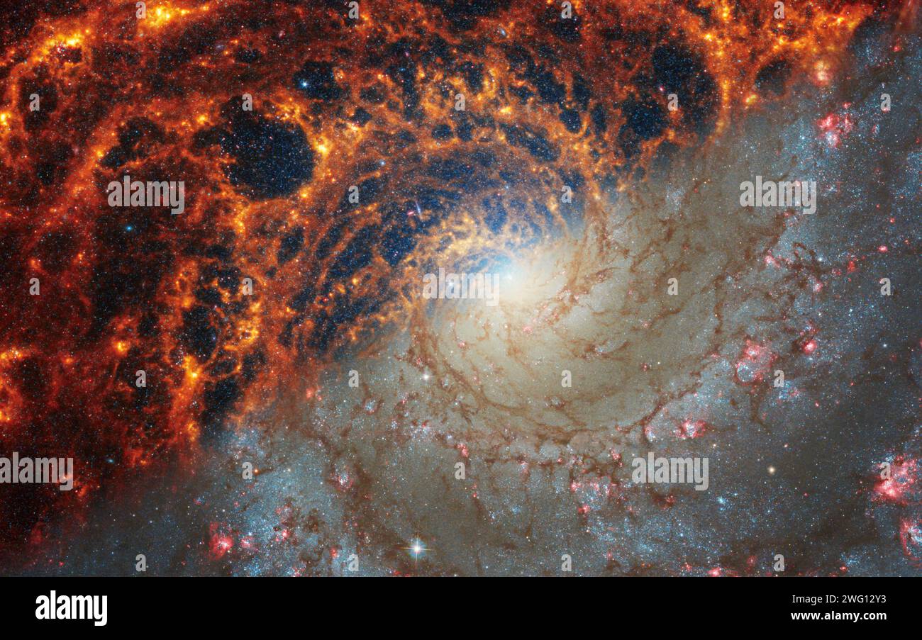 Face-on spiral galaxy, NGC 628. Bright orange and red galactic long-range captured imagery. Elements of this image furnished by NASA (combination of i Stock Photo