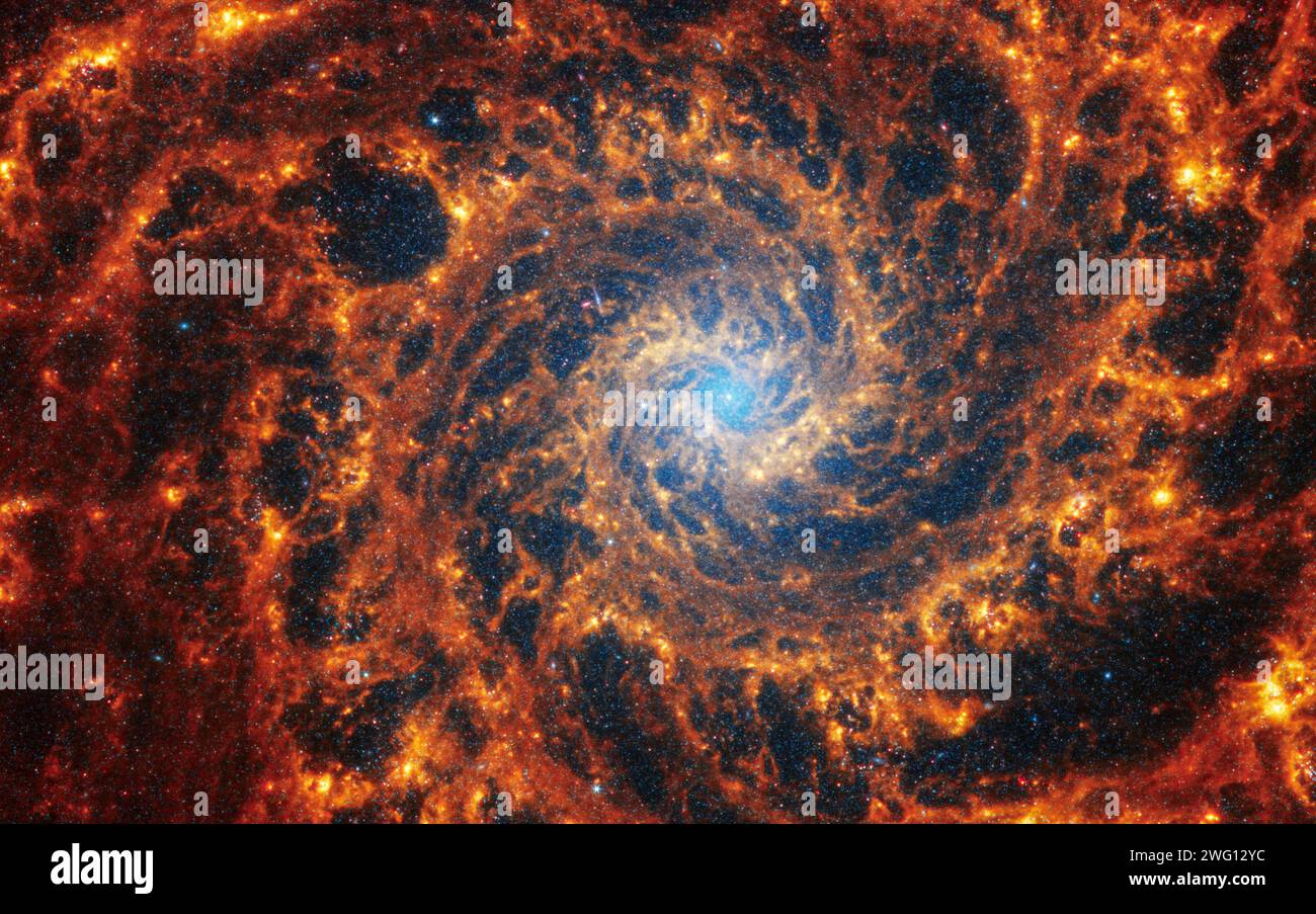 Face-on spiral galaxy, NGC 628. Bright orange and red galactic long-range captured imagery. Elements of this image furnished by NASA (observed by the Stock Photo