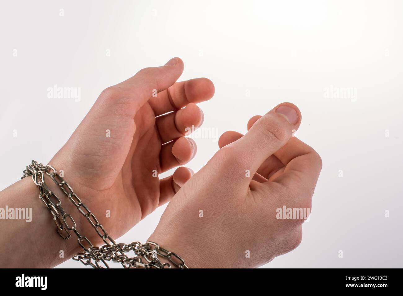 Hands in chains on a white background Stock Photo - Alamy