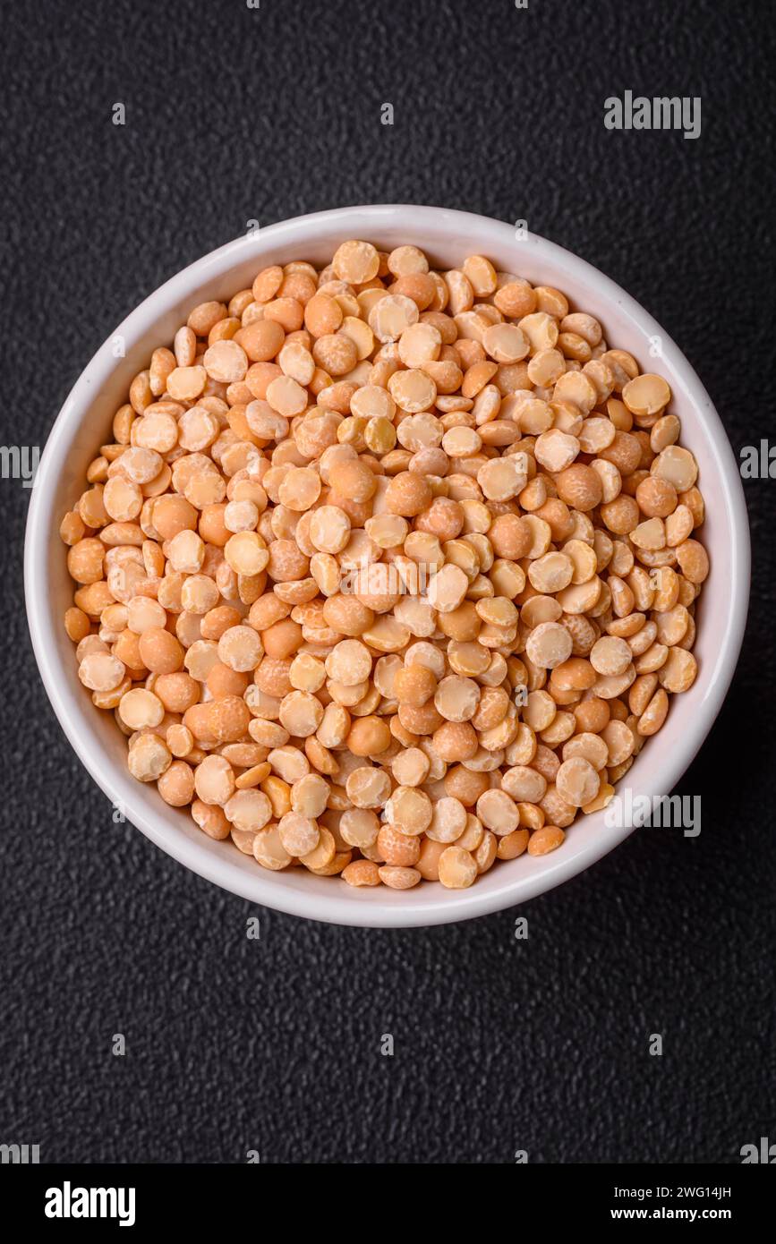 Dried pea grains, divided into halves, are yellow in color when raw