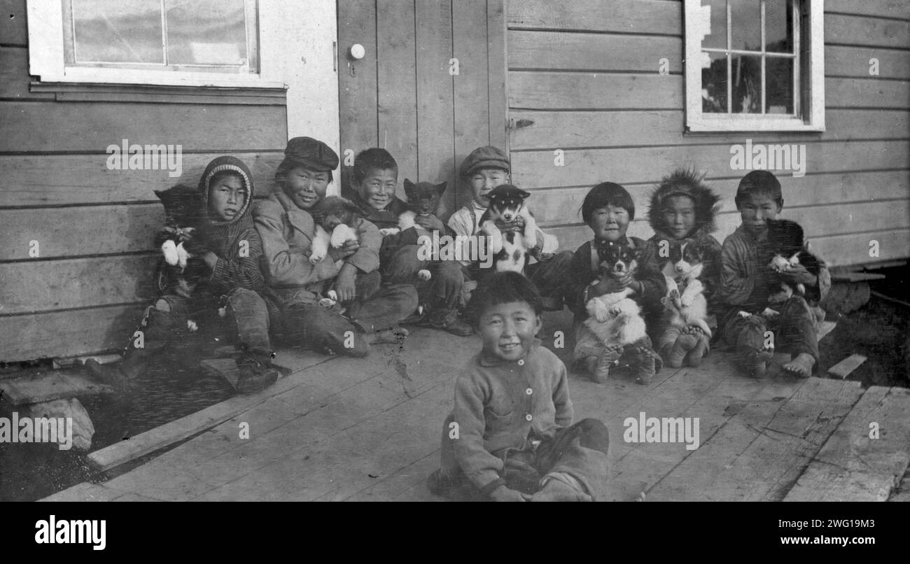 Eskimo children and puppies at the Moravian Mission Station, between ...