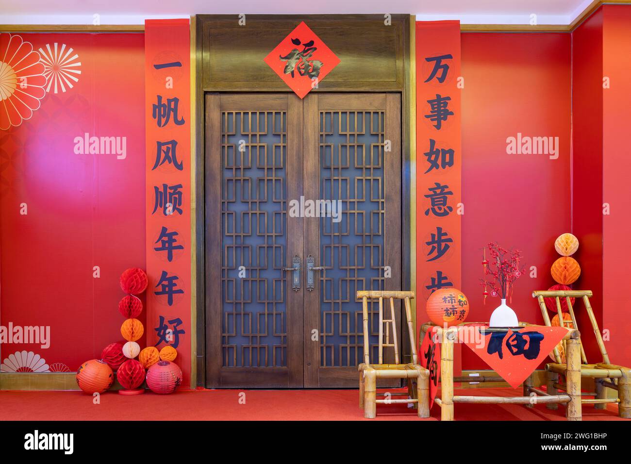 gate with Chinese new year decorations and English translation of the