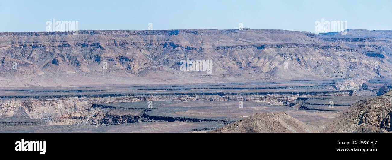 aerial landscape with wandering cracks over escarpment plateau  from Canyon viewpoint, shot in bright late spring light at Fish River Canyon, Namibia, Stock Photo