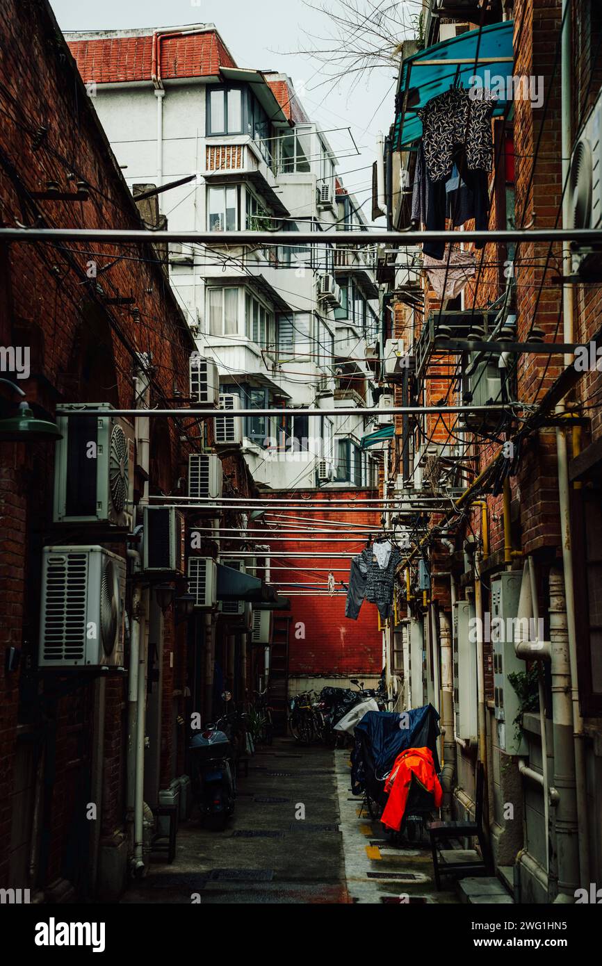 crowded street with drying ropes in Shanghai, China Stock Photo - Alamy
