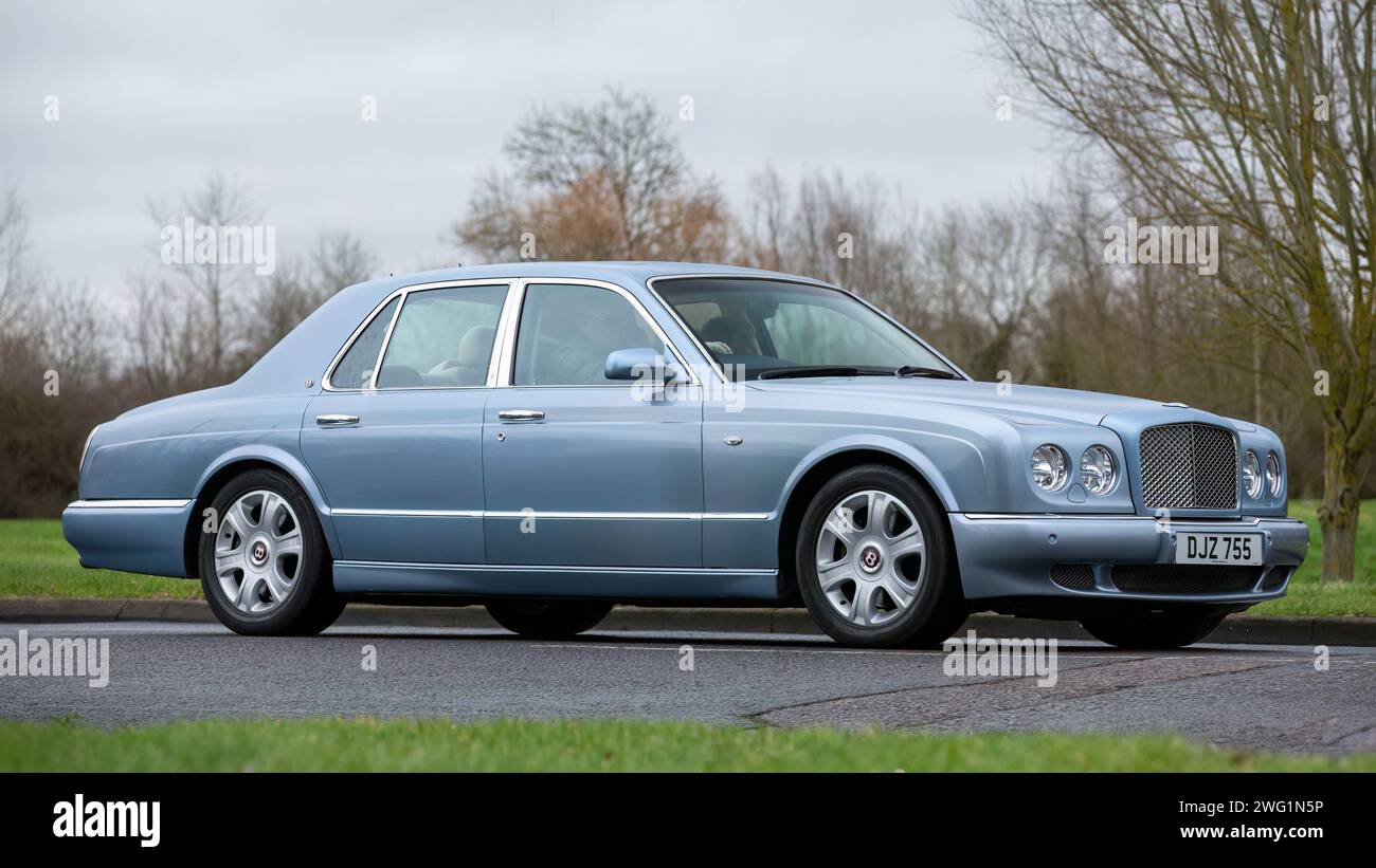 Milton Keynes,UK-Jan 18th 2024: 2005 blue Bentley Arnage luxury car driving on an English country road. Stock Photo