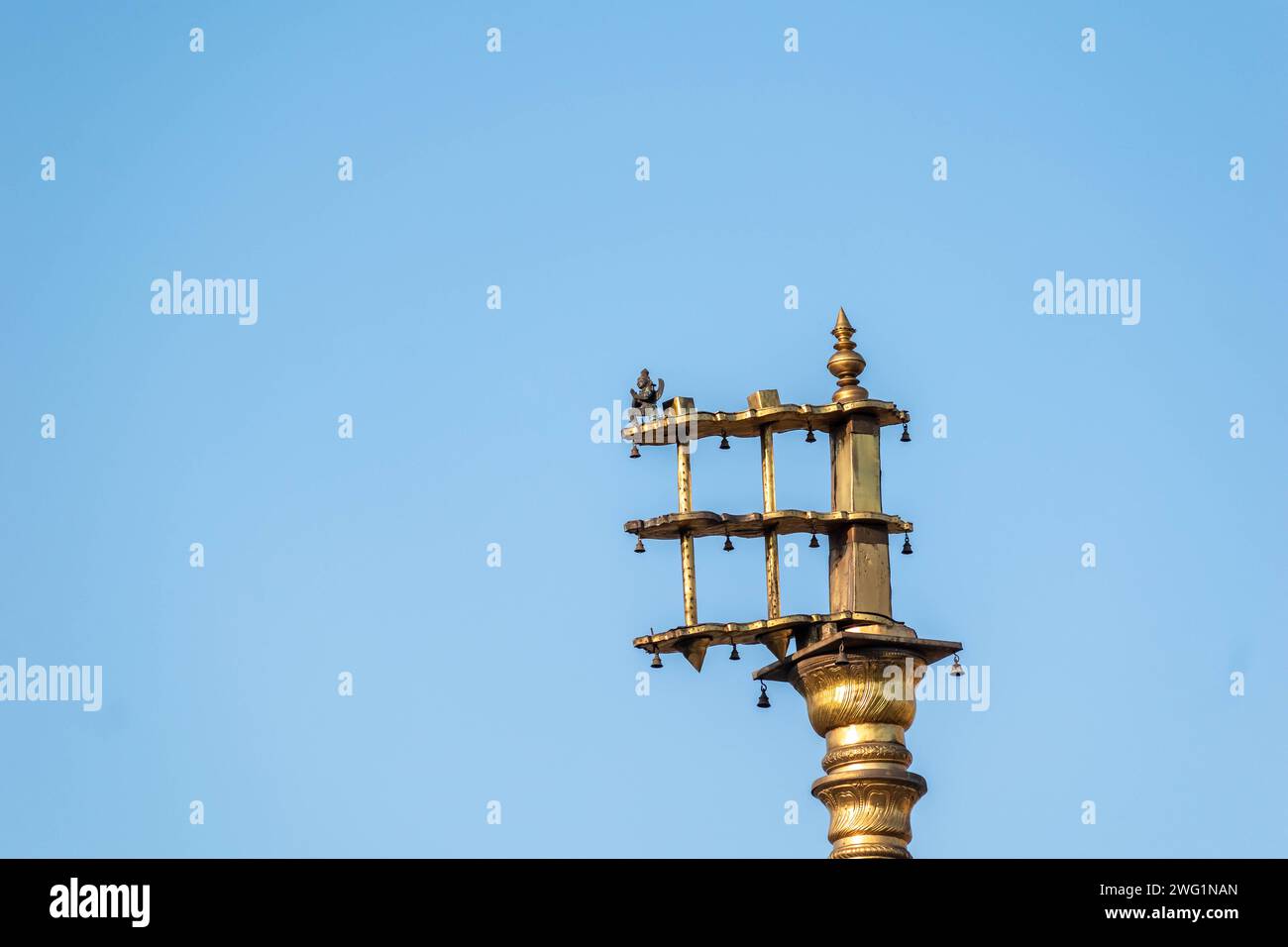 Belur, Karnataka, India - January 9 2023: The golden Dhwaja Stambh pillar in the historic Chennakeshava temple in Belur. Stock Photo