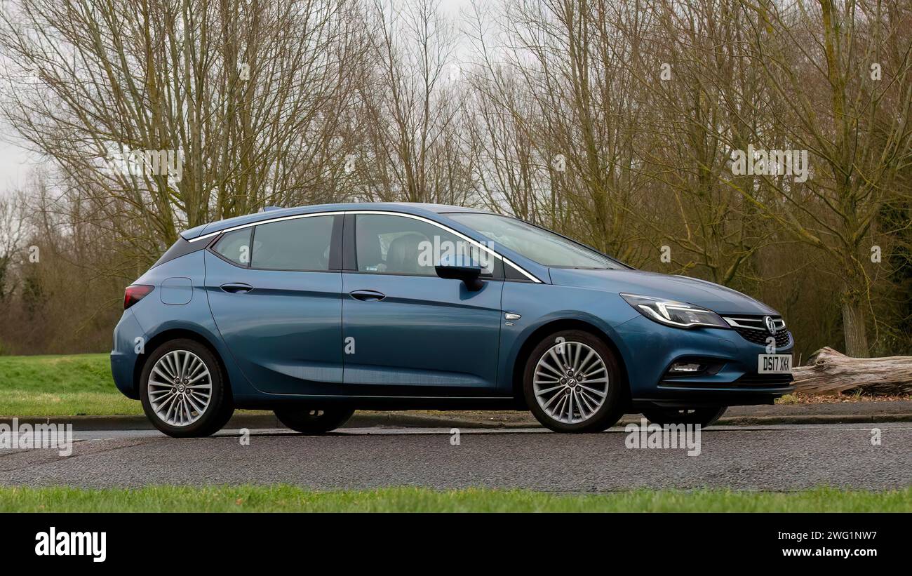 Milton Keynes,UK-Jan 18th 2024: 2017 blue Vauxhall Astra estate car driving on an English country road. Stock Photo