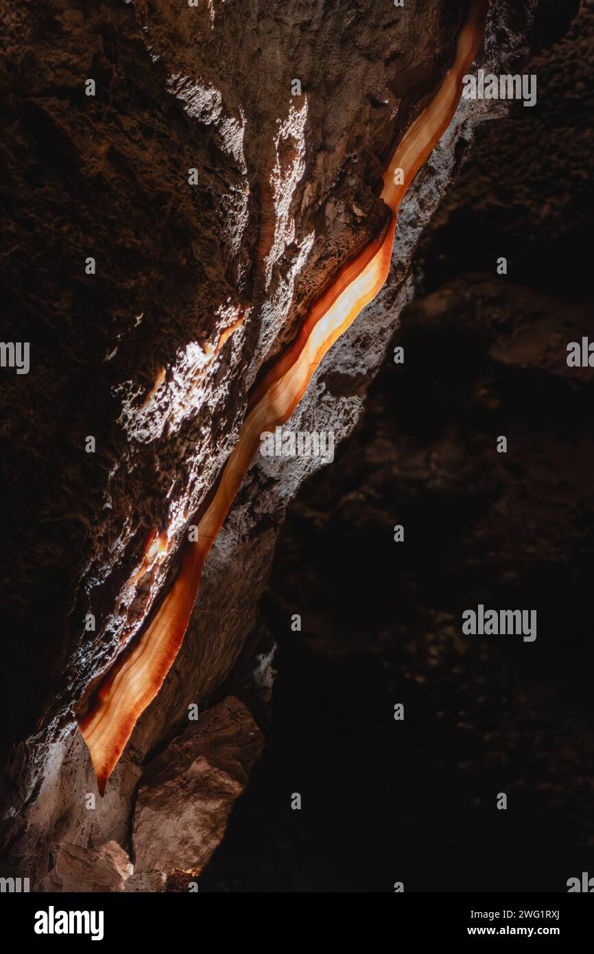 A 20-foot calcite flowstone formation in Jewel Cave National Monument - often referred to as 'cave bacon' Stock Photo