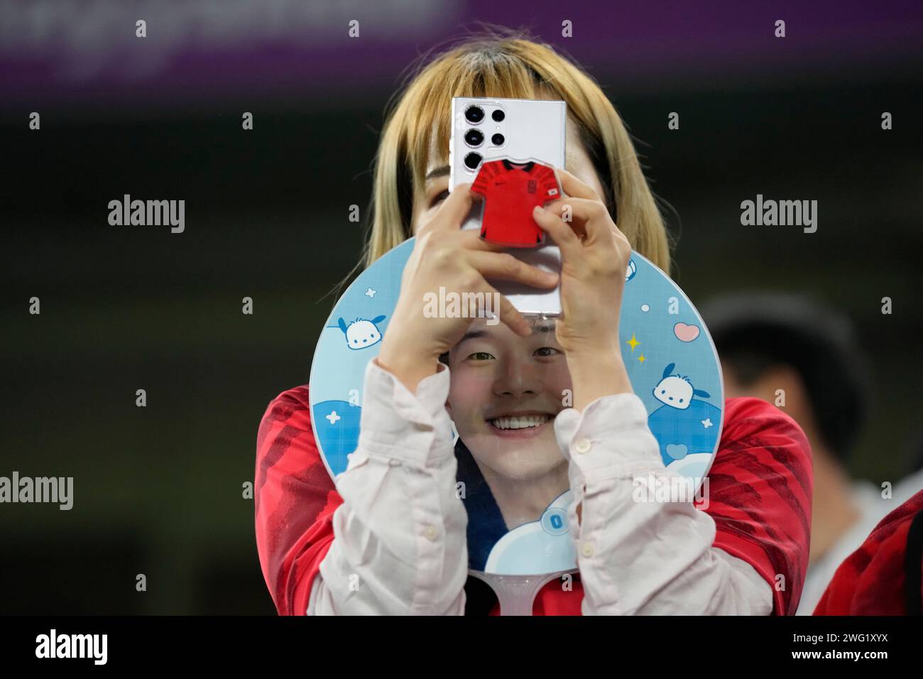 South Korea's fan holds a portrait of South Korea's Son Heung-min ...
