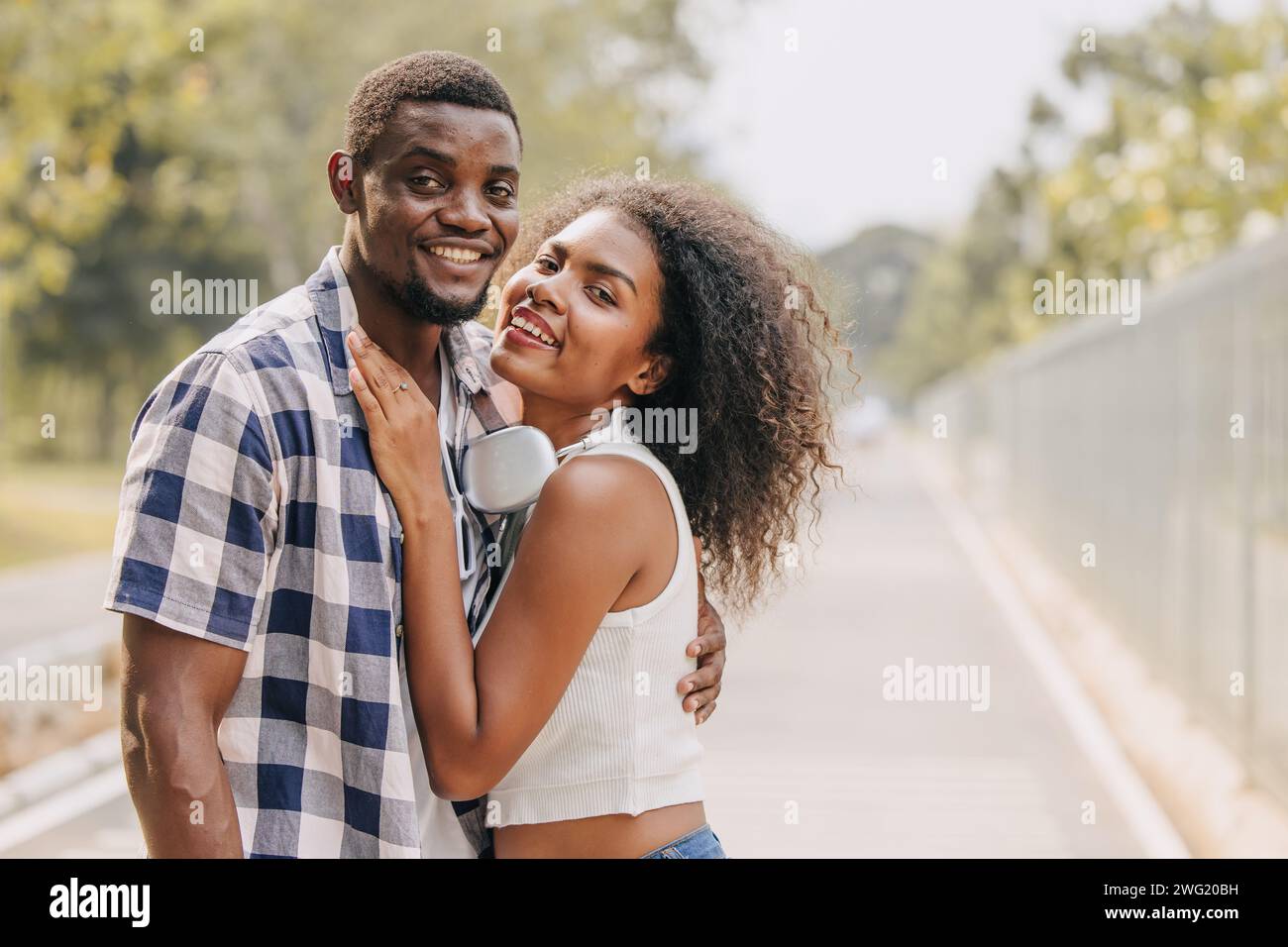 Date couple man and women valentine day. African black lover at park outdoors summer season vintage color tone Stock Photo