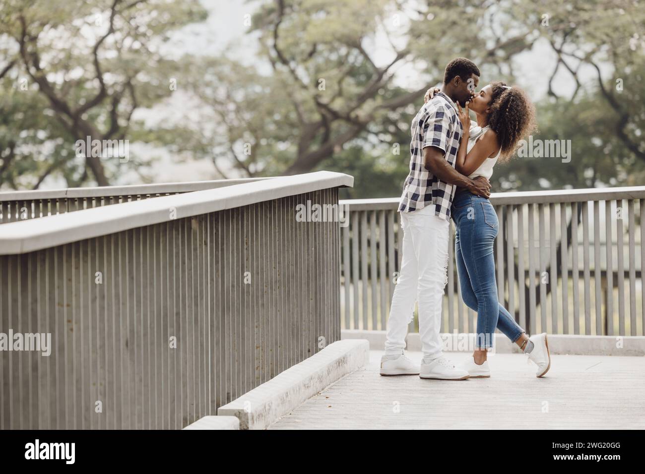 Date couple man and women valentine day. African black lover at park outdoors summer season vintage color tone Stock Photo