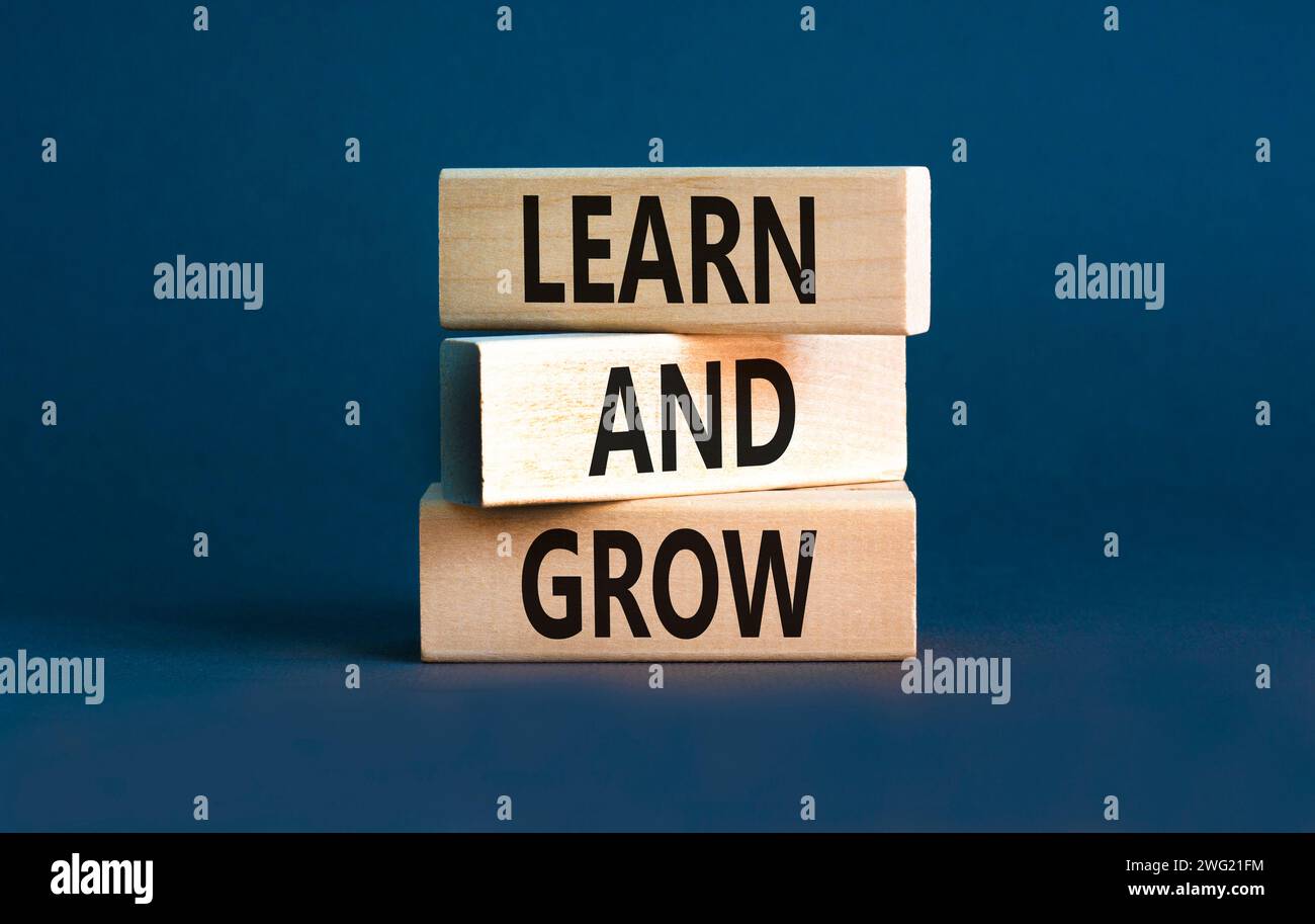 Learn and grow symbol. Concept word Learn And Grow on beautiful wooden ...