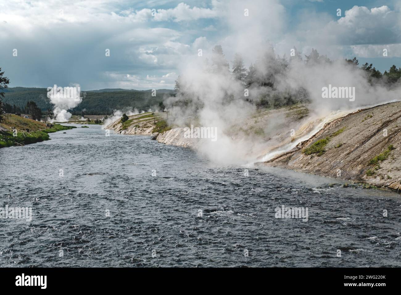 Steam rising over Firehole River, from Grand Prismatic Spring in Yellowstone National Park Stock Photo