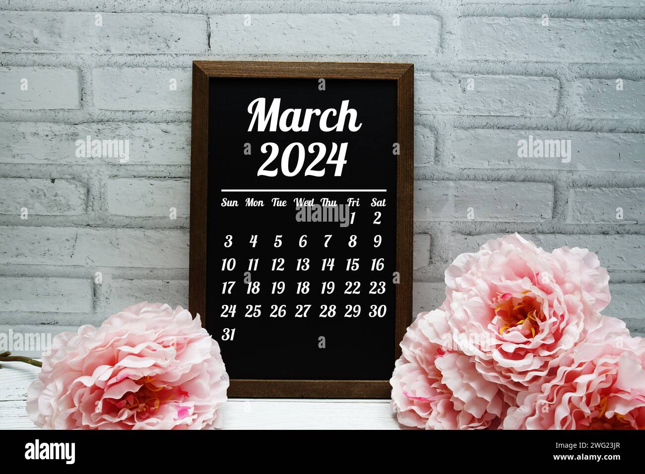 March 2024 monthly calendar on chalkboard for planning and management ...