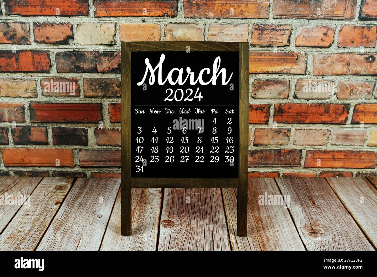 March 2024 monthly calendar on chalkboard for planning and management ...