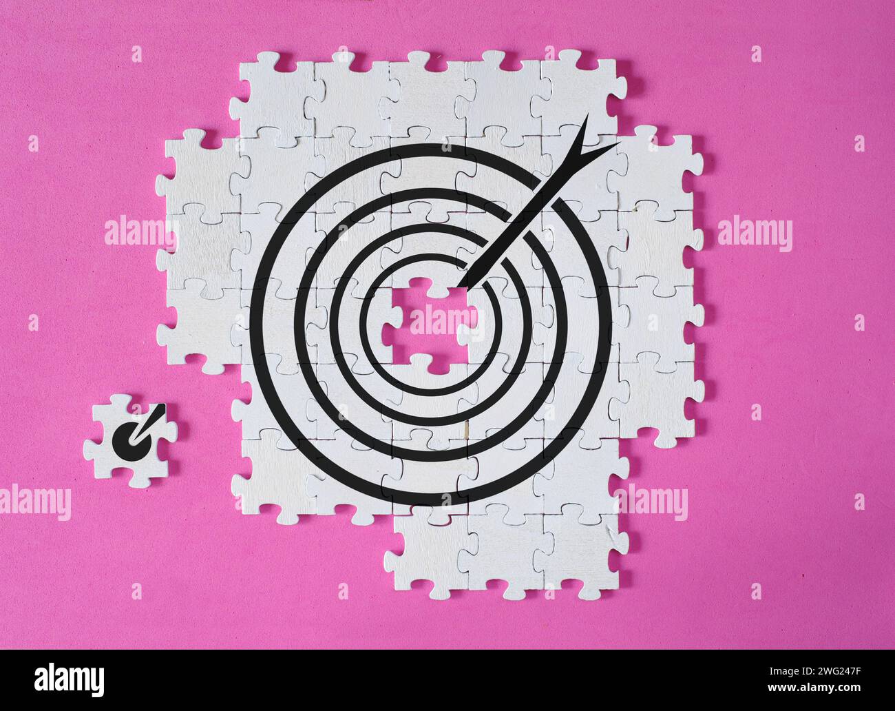 Business growth,success, innovation and human resources concept, arranged puzzle pieces with target and arrow for planning development, innovation,lea Stock Photo