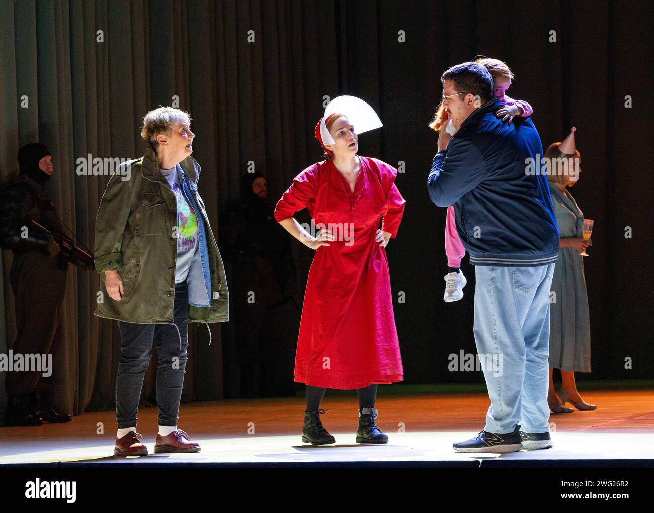 l-r: Susan Bickley (Offred's Mother), Kate Lindsey (Offred), John Findon (Luke) in THE HANDMAID'S TALE at English National Opera (ENO), London Coliseum, London WC2  01/02/2024  music: Poul Ruders  libretto: Paul Bentley after the novel by Margaret Atwood  conductor: Joana Carneiro  design: Annemarie Woods  video design: Akhila Krishnan  original lighting: Paule Constable  original movement & intimacy coordinator: Imogen Knight  director: Annilese Miskimmon Stock Photo