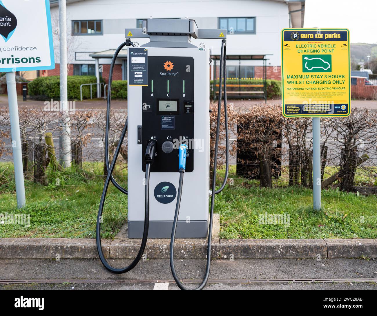 A single Sea Charger EV charging station in Morrisons supermarket car park in Teignmouth, Devon with a maximum stay of 3 hours. Stock Photo