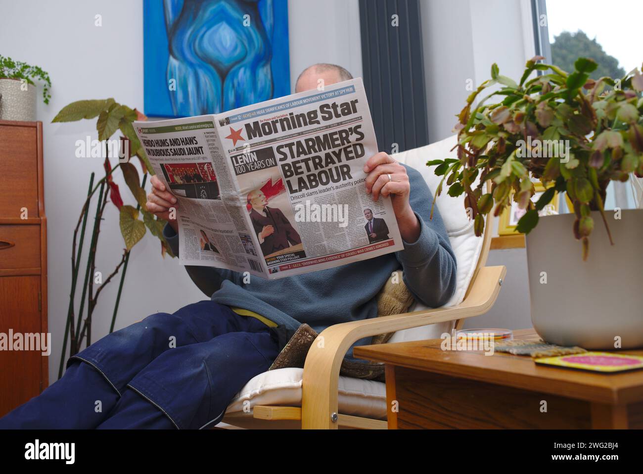 Man reading Morning Star newspaper. Stock Photo