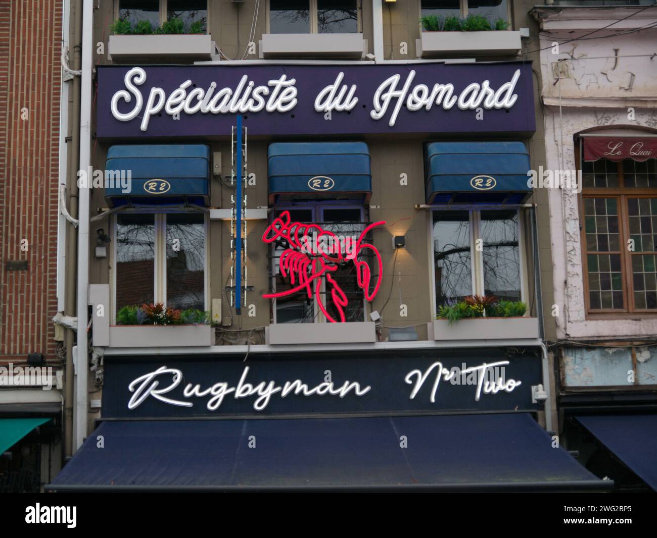 Brussels, Belgium. 2nd Feb, 2024. Restaurant Rugbyman N°Two with delicious seafood. Building facade. Architecture along Quai aux Briques. Lobster Stock Photo