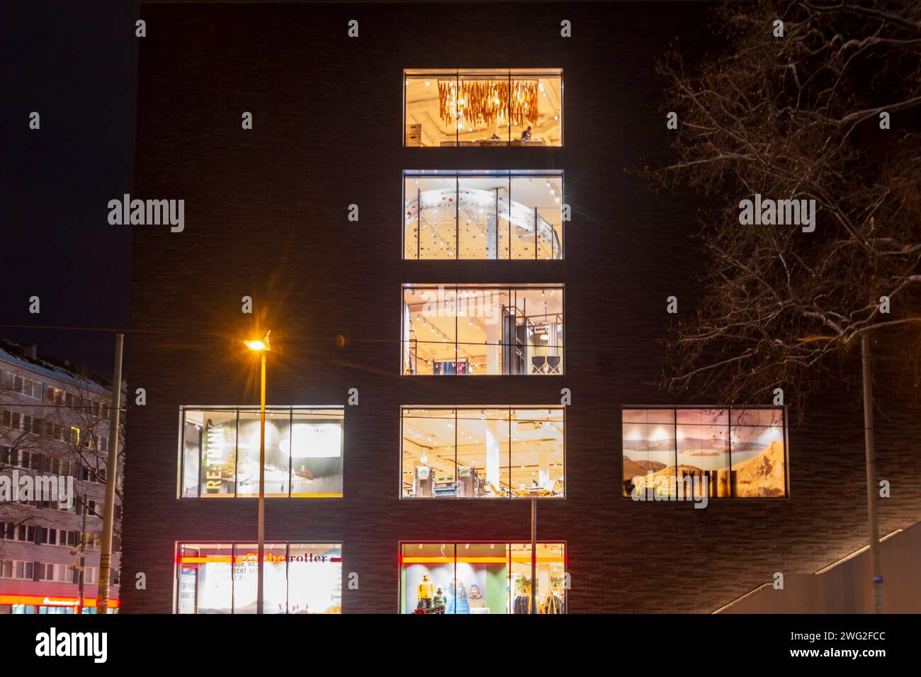 Frankfurt am Main: lit  windows of Globetrotter outdoor shop in Frankfurt Rhein-Main, Hessen, Hesse, Germany Stock Photo