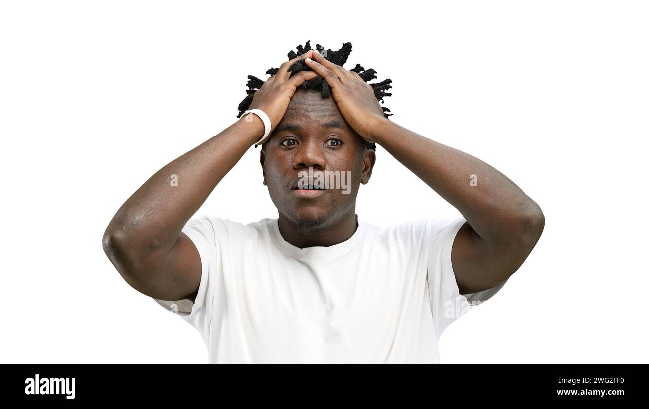 A man, close-up, on a white background, clutched his head Stock Photo