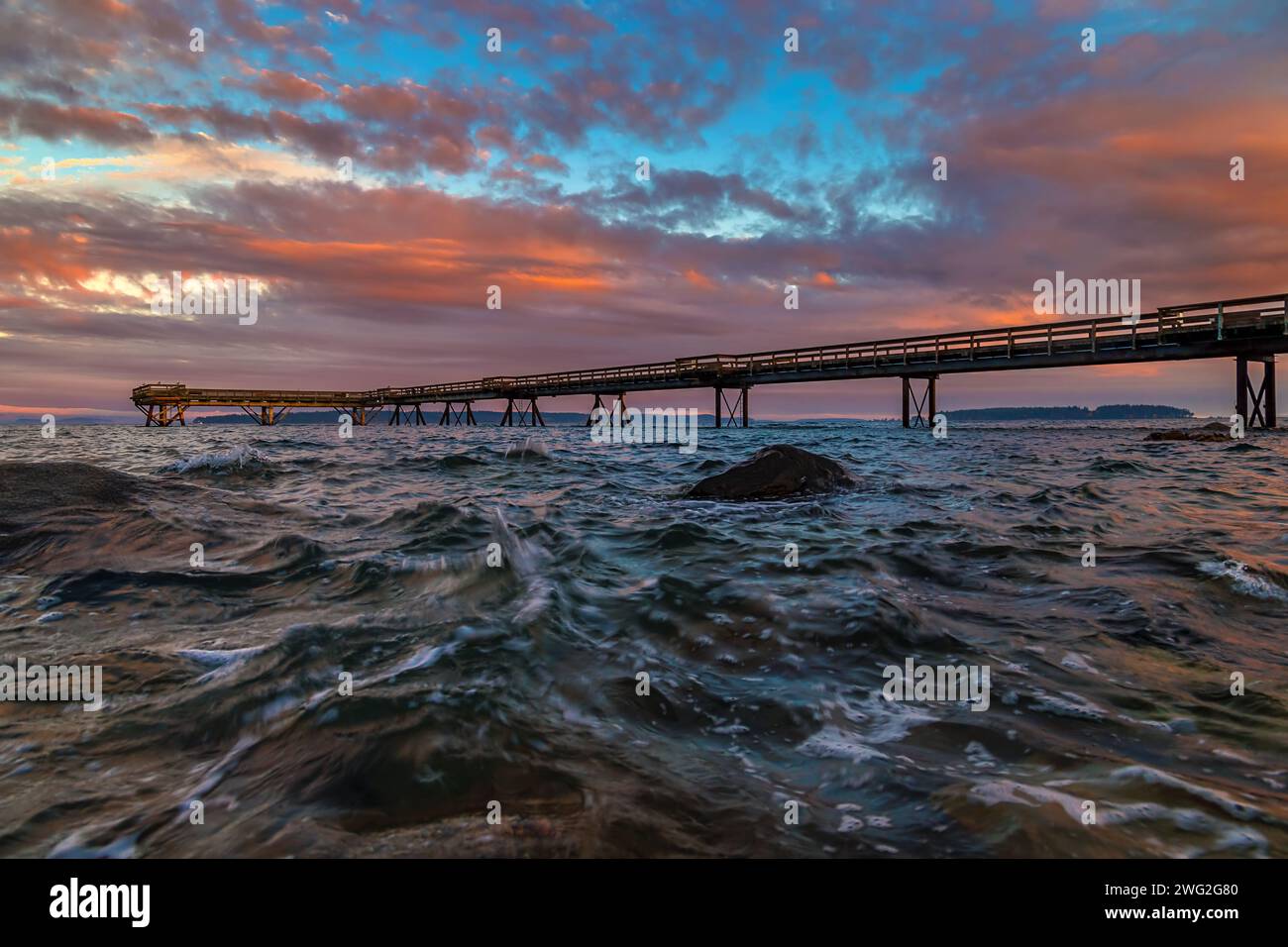 Sunset Over An Ocean Pier Stock Photo
