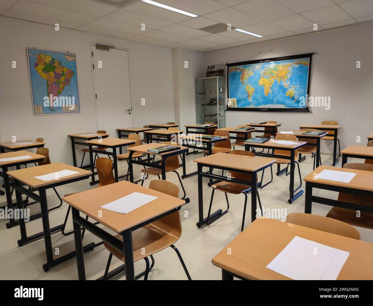 Tables and maps in a geography classroom in a Dutch high school. Stock Photo