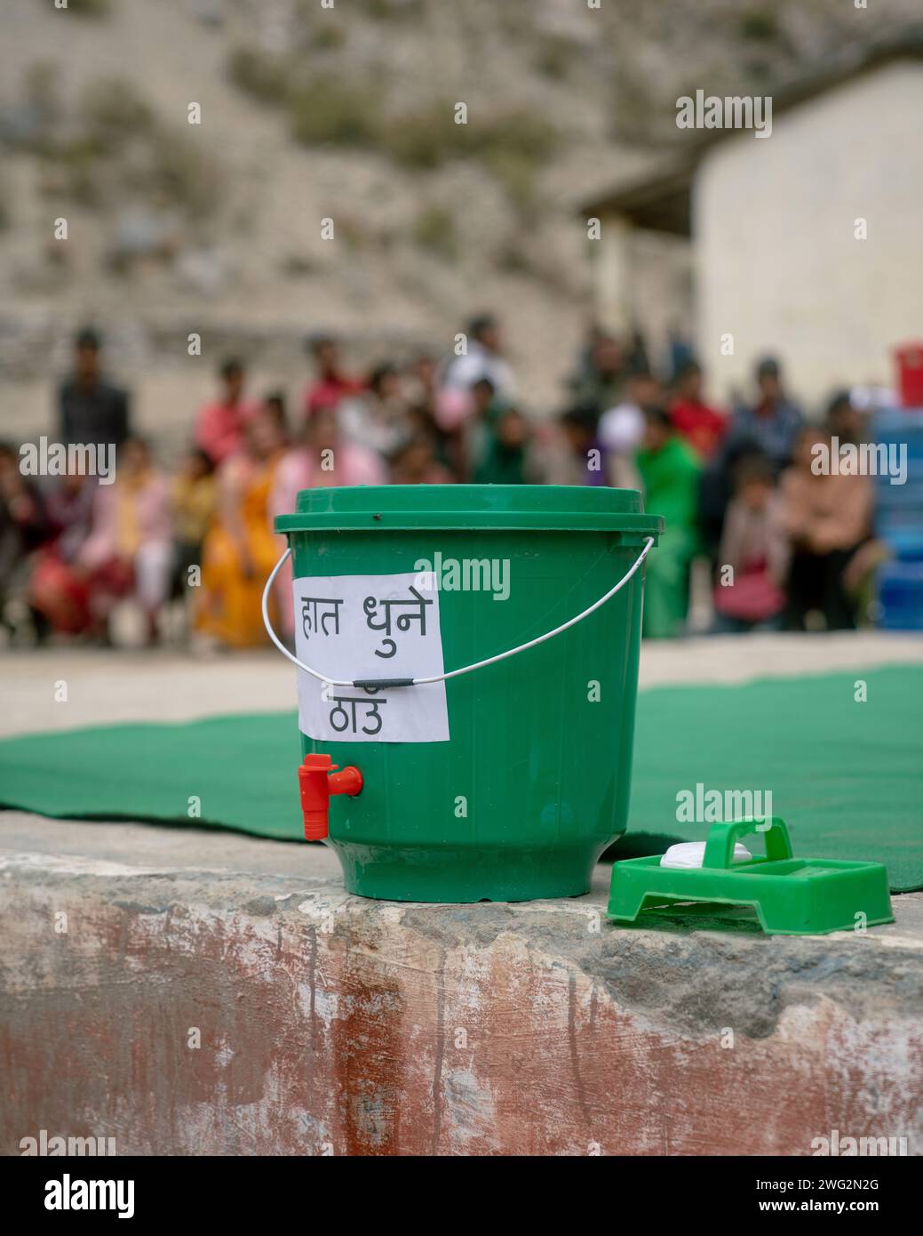 Plastic water dispenser provides clean water to a community event in Palata, Dolpa District, Western Nepal, 2023. Stock Photo