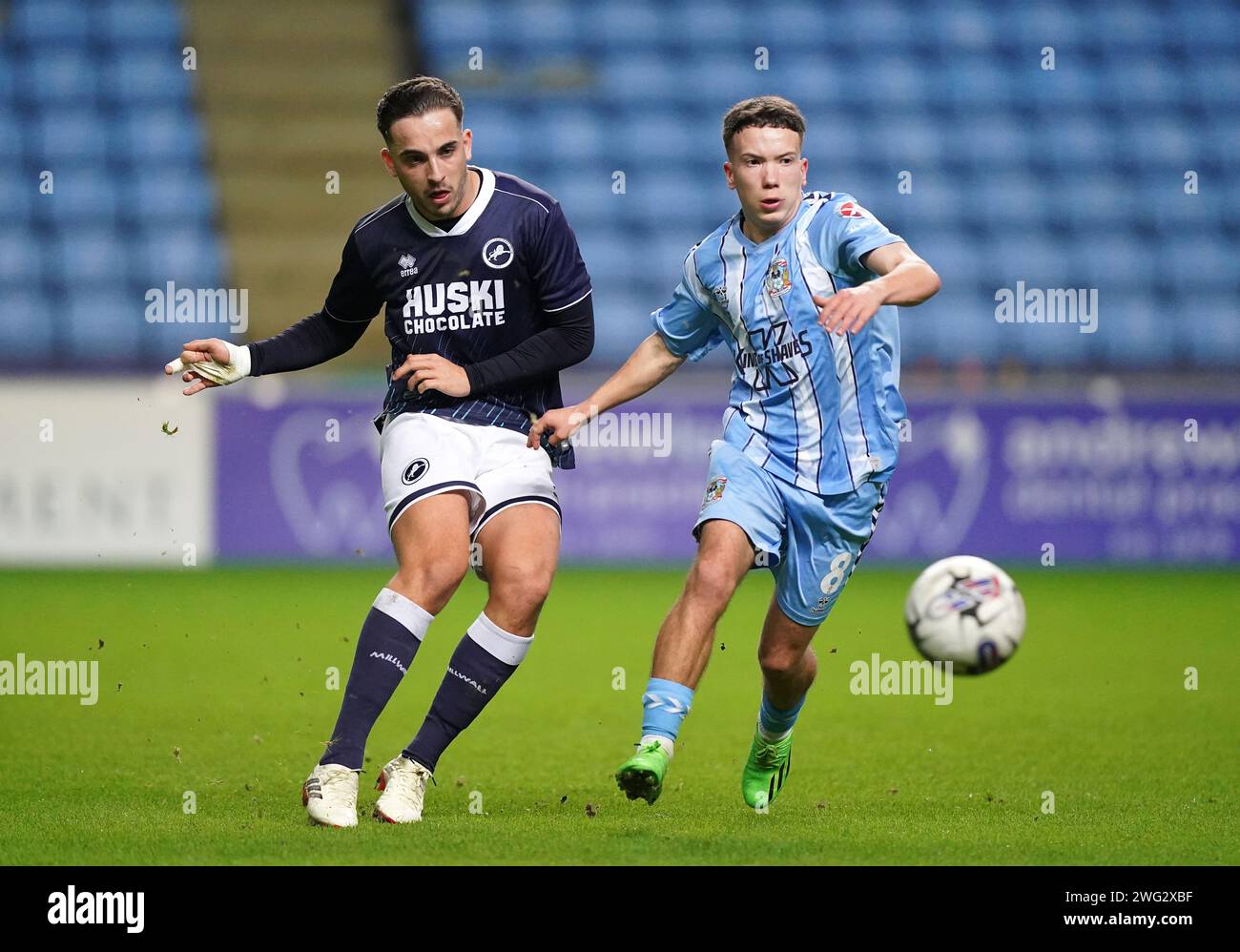 Millwall's Alfie Massey and Coventry City's Elliot Betjemann battle for ...