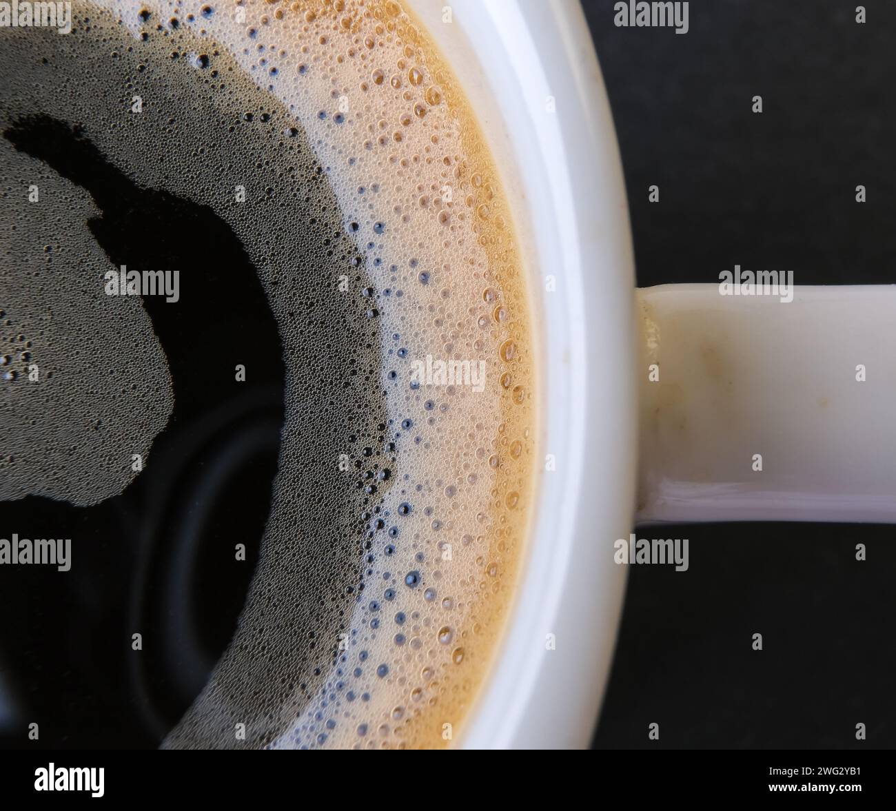 macro photo of espresso foam in white cup Stock Photo