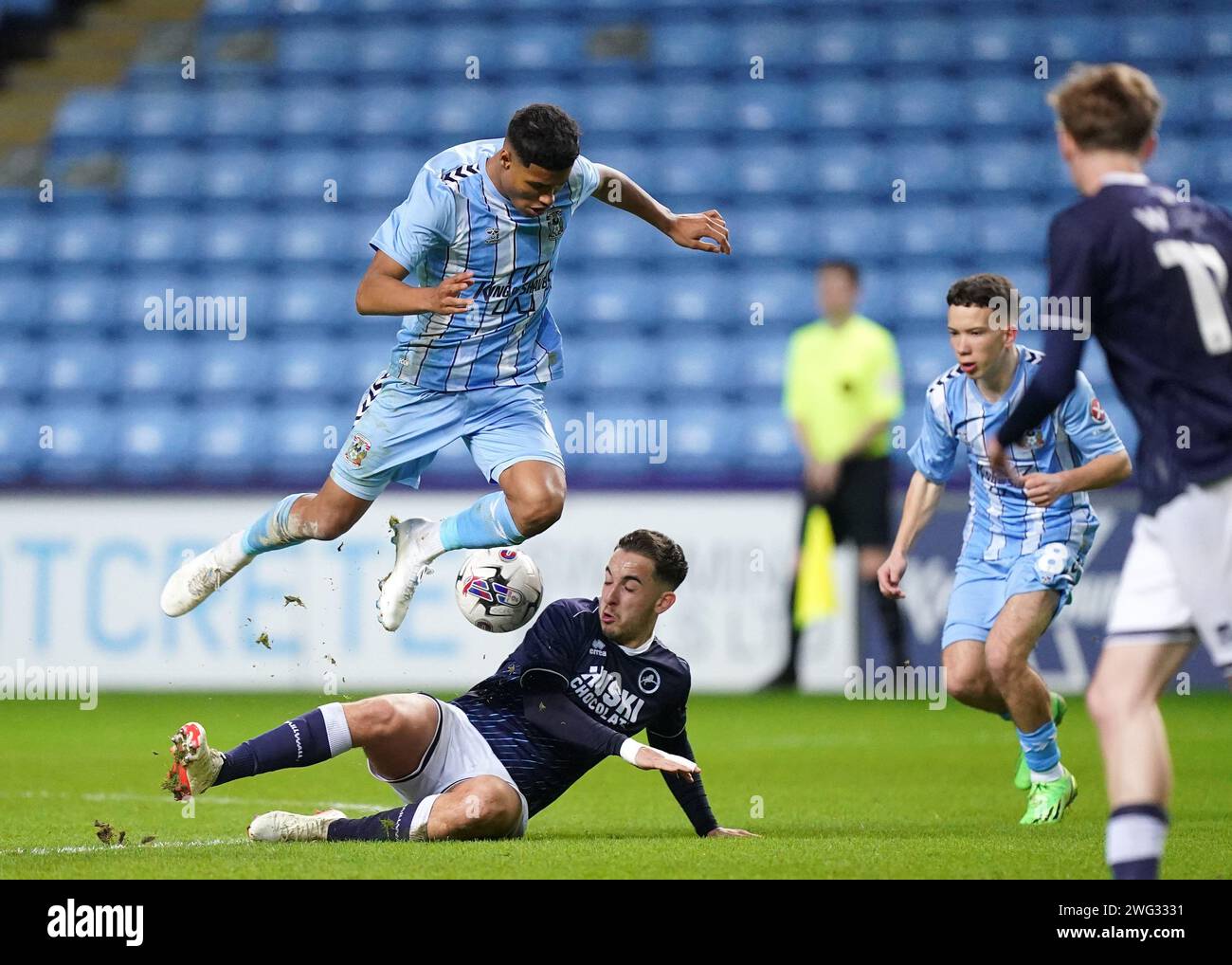 Coventry City's Kai Andrews tackled by Millwall's Alfie Massey during ...