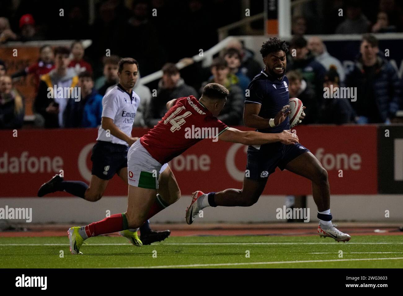 Amena Caqusau of Scotland U20's makes a break past Harry ReesWeldon of