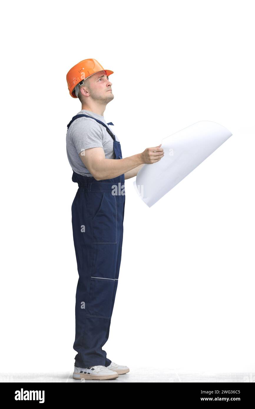 Builder, on a white background, full-length, with a drawing Stock Photo