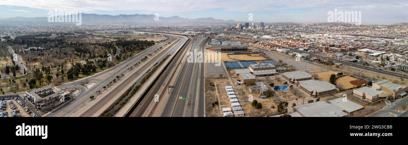 Aerial panoramic photograph of the international border between El Paso, Texas (on the right) and Ciudad Ju‡rez, Mexico on an overcast day. Stock Photo