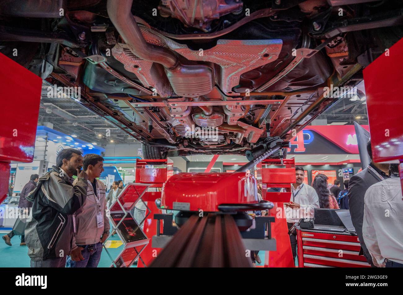 New Delhi, India. 02nd Feb, 2024. Visitor looks at the undercarriage of a car being showcased during the 5th edition of ACMA Automechanika New Delhi at the Bharat Mobility Global Expo 2024. The exhibition organized by ACMA, the Automotive Component Manufacturers Association, represents manufacturers in the Indian auto component industry, with 500  exhibitors from India and 12 other countries participating in the expo. (Photo by Pradeep Gaur/SOPA Images/Sipa USA) Credit: Sipa USA/Alamy Live News Stock Photo