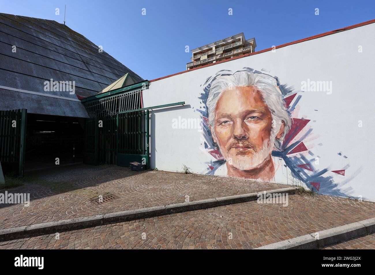A mural depicting the Australian activist Julian Assange, by street artist Trisha Palma, in the Scampia neighborhood of Naples. Stock Photo