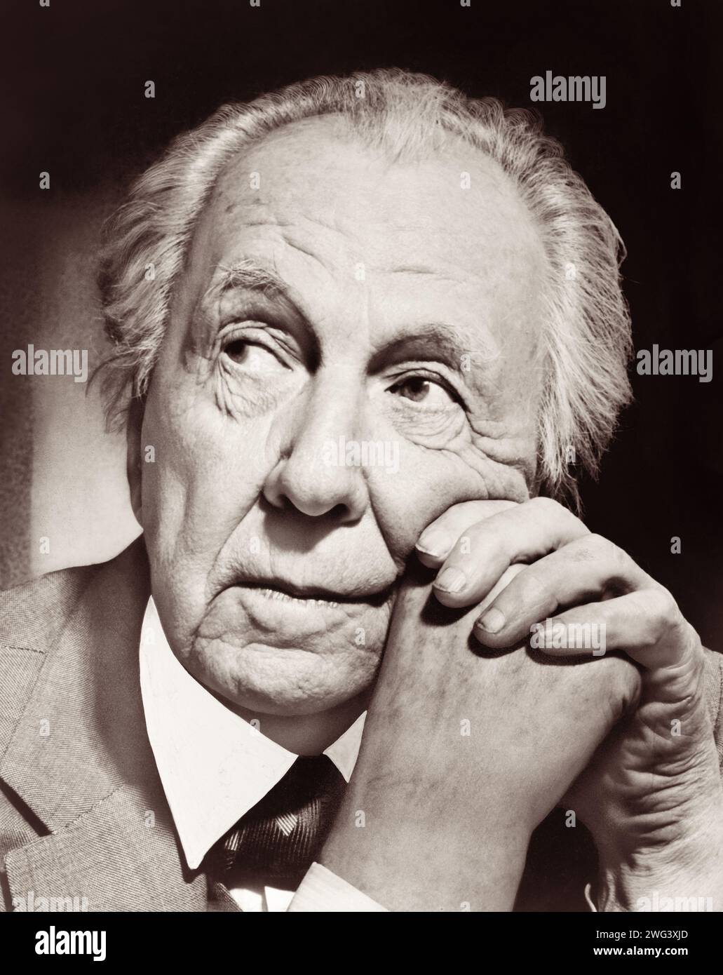 Frank Lloyd Wright (1867-1959), American architect pioneer of the Prairie School movement, in a portrait from 1954. Wright would later be recognized (in 1991) by the American Institute of Architects as 'the greatest American architect of all time.' Stock Photo