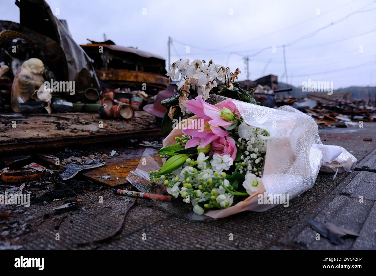 Ishikawa, Japan. 01st Feb, 2024. A month has passed since the Noto Peninsula earthquake. Flowers were laid at the Wajima Morning Market, a famous sightseeing spot that burned down. The Noto region of Ishikawa Prefecture, the epicenter of the earthquake, was shaken with an intensity of up to 7 on the Japanese scale, causing extensive damage. According to Ishikawa Prefecture, the number of confirmed fatalities in the prefecture remained unchanged at 240 as of 2:00 p.m. on February 2. Credit: SOPA Images Limited/Alamy Live News Stock Photo