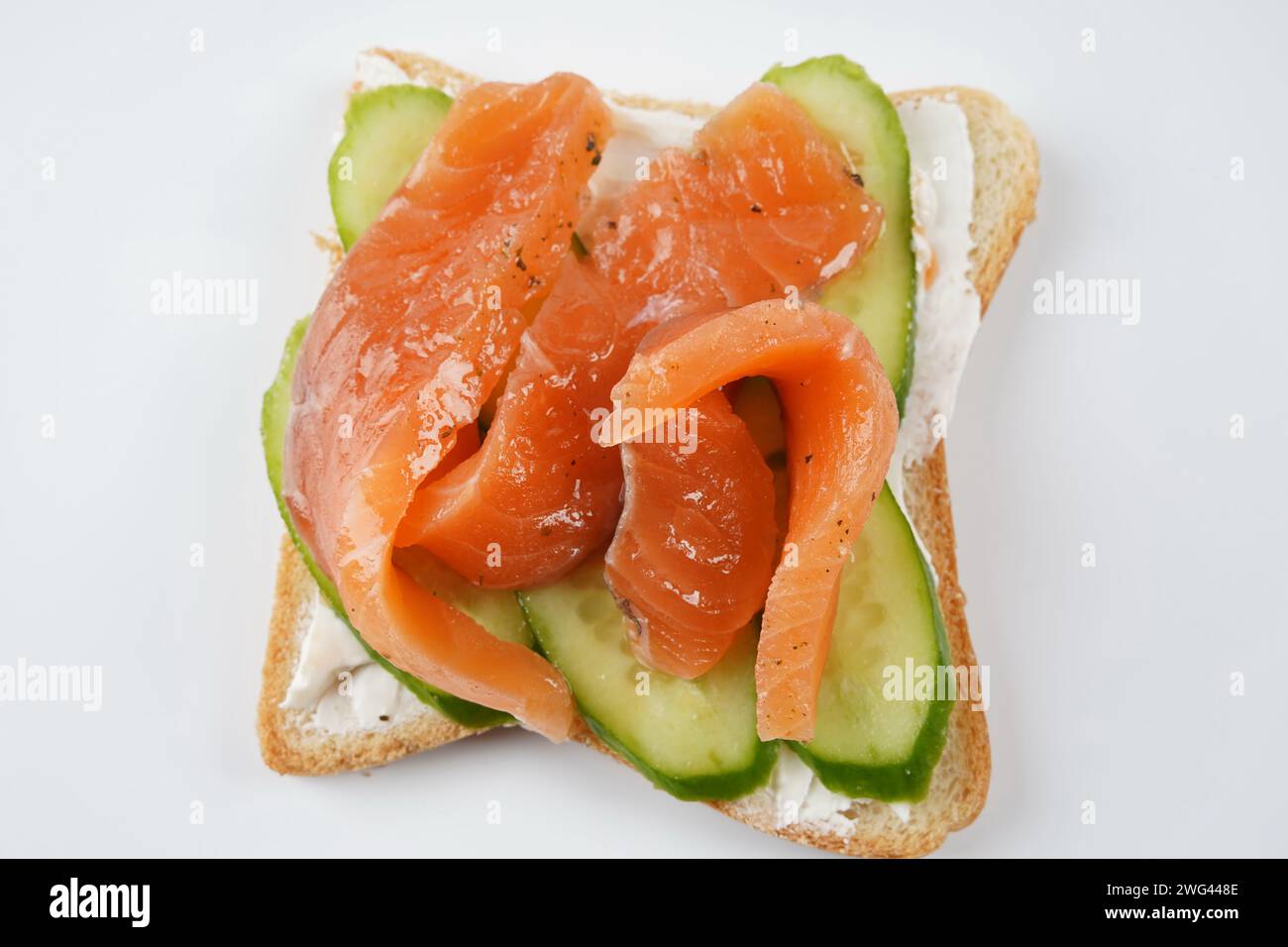 Open sandwich with salted salmon, cream cheese and cucumber Stock Photo