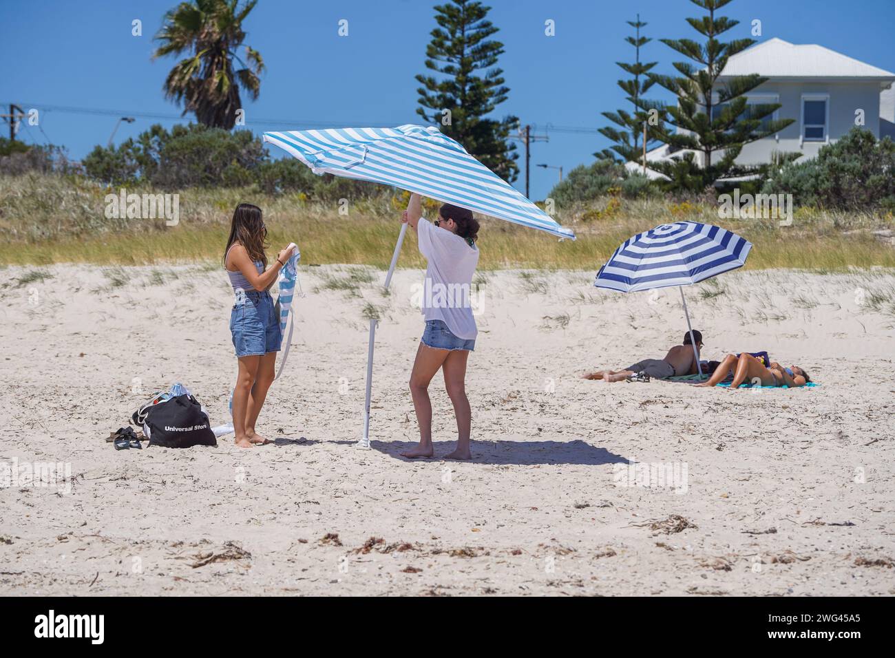 Adelaide, SA Australia 3 February 2024 . Beachgoers adjust their ...