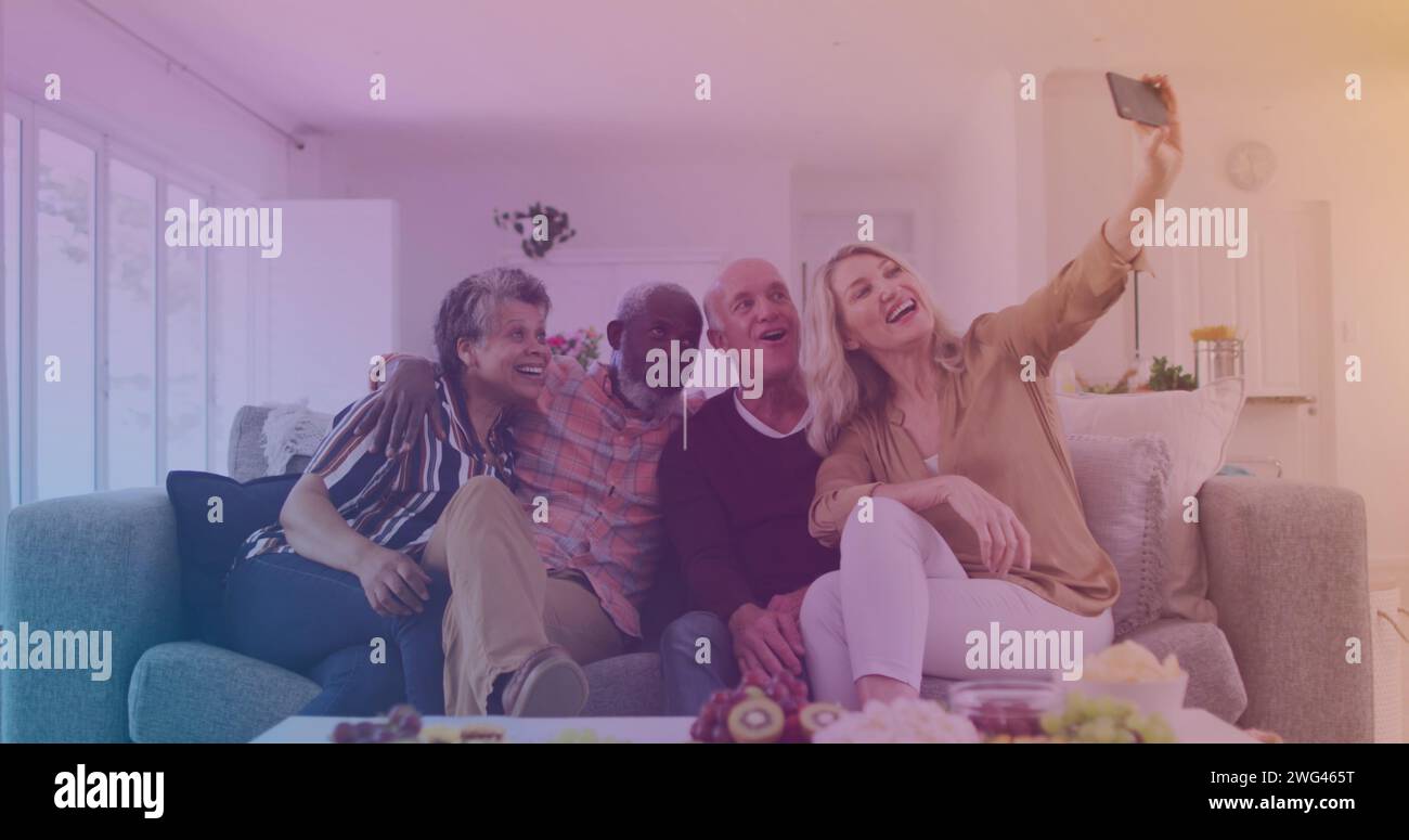 Diverse group captures a selfie at home Stock Photo