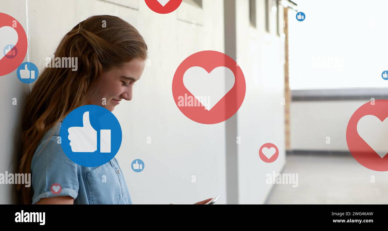 Heart and like icons floating against caucasian woman smiling while ...