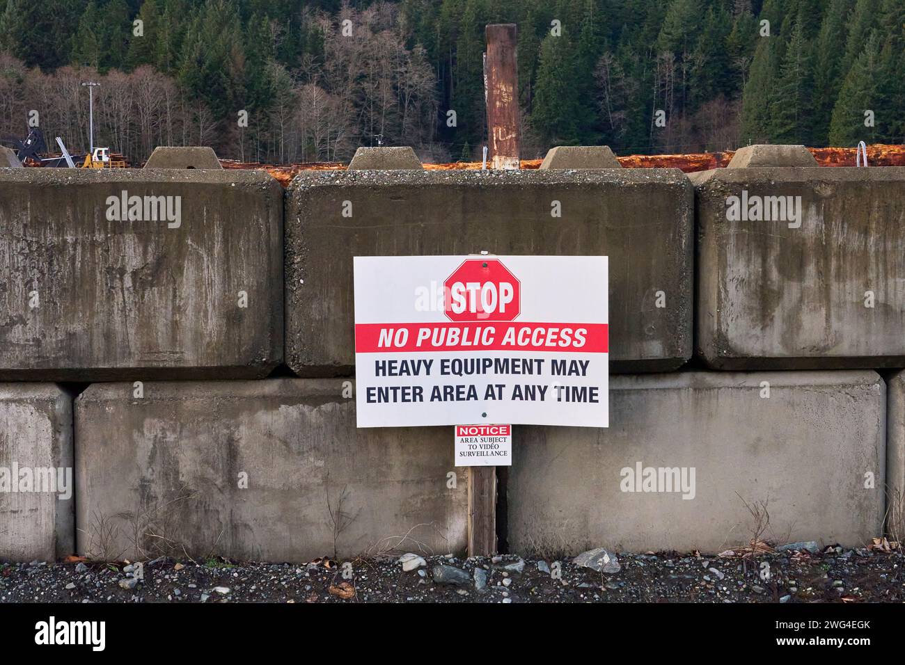 A sign warning public to stay out, Dangerous industrial yard Stock Photo