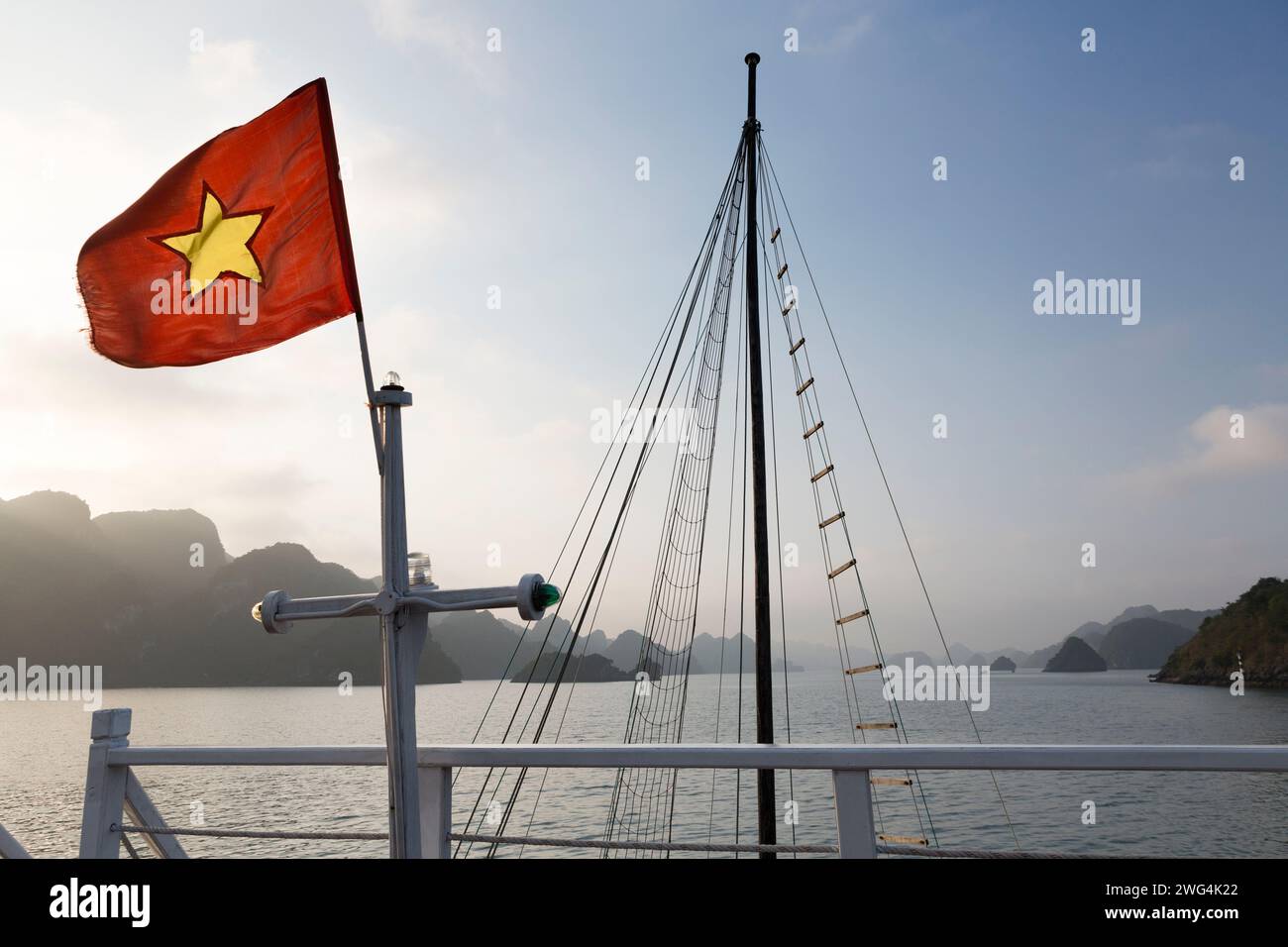 Vietnam, Halong Bay, view from the back of a tourist boat seeing the sights of the bay. Stock Photo