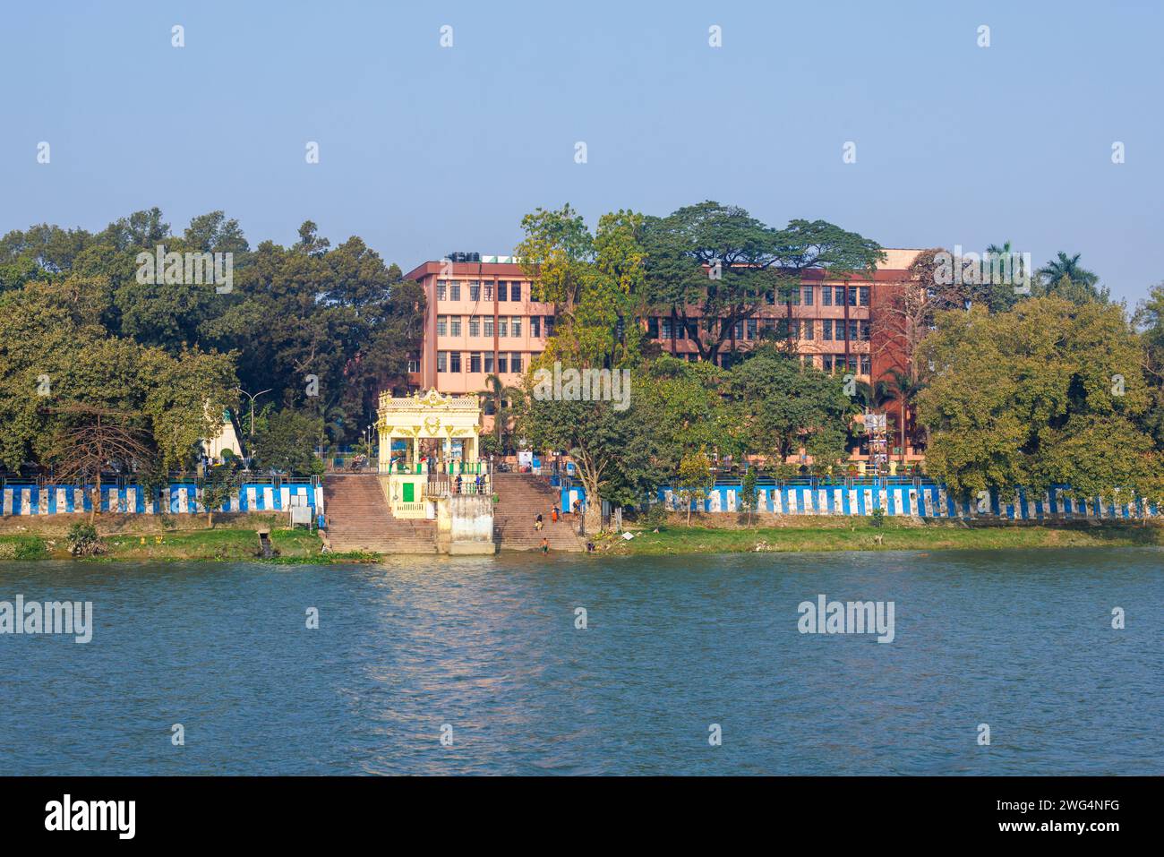 Typical riverside ghat and steps on the banks of the Hooghly River at dusk in Chandannagar (Chandernagore), North Barrackpore, West Bengal, India Stock Photo
