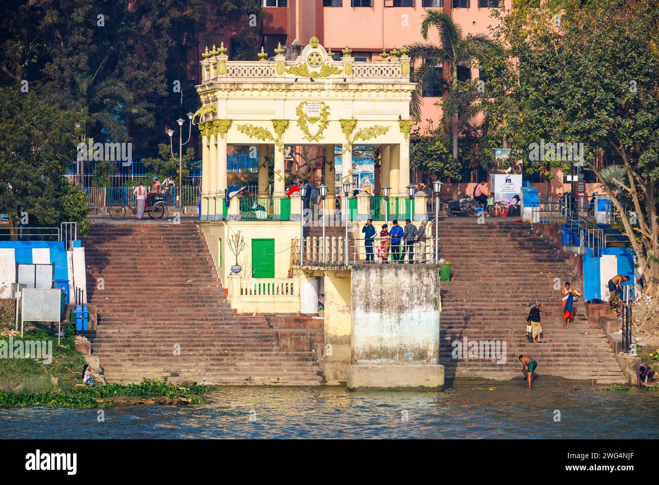 Typical riverside ghat and steps on the banks of the Hooghly River at dusk in Chandannagar (Chandernagore), North Barrackpore, West Bengal, India Stock Photo