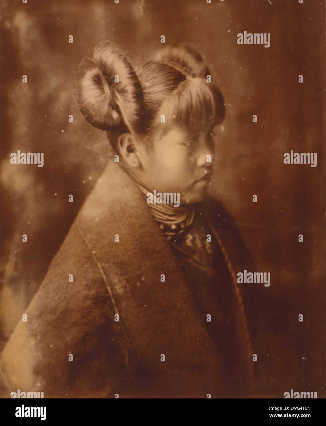 Modified style of hair dressing-Hopi, c1921. Hopi girl, half-length portrait, facing right. Stock Photo