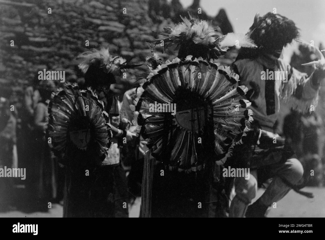 Buffalo dancers, c1905. Costumed dancers wearing dance bustles of Tewa sun god made of turkey feathers. Stock Photo